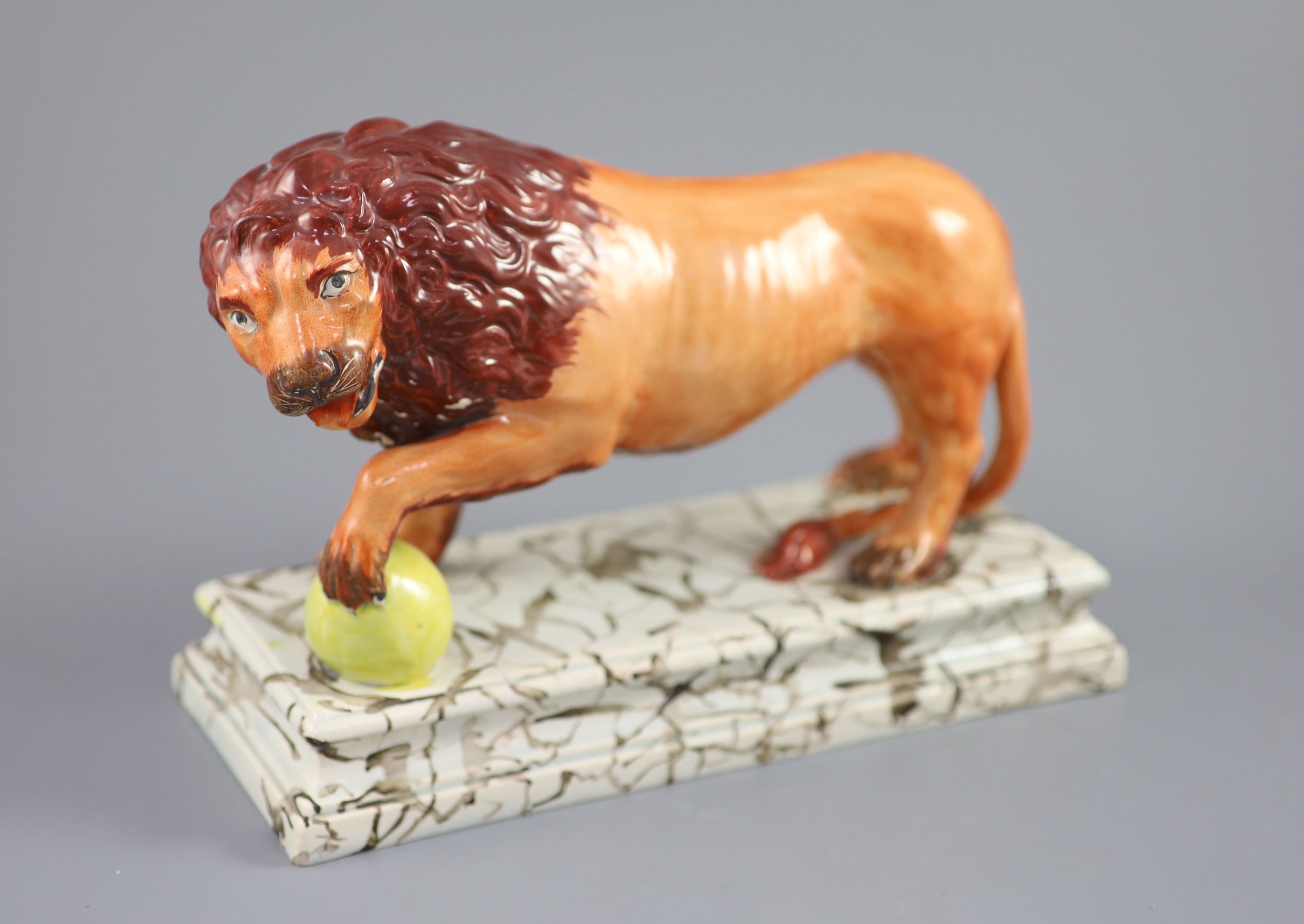 An Enoch Wood pearlware figure of a Medici Lion, c.1800-10, 28cm long